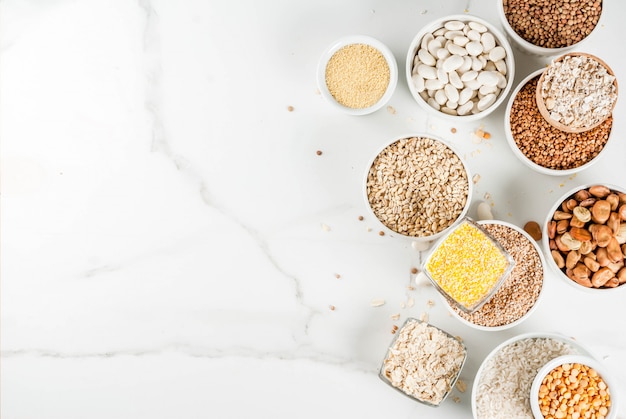 Selection various types cereal grains groats  in different bowl