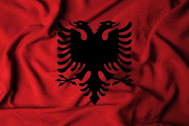 Photo selective focus of albanian flag with waving fabric texture 3d illustration