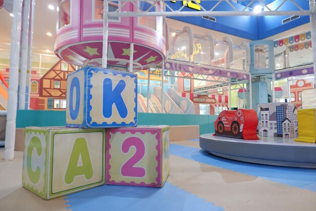 Selective focus on blocks of letters and numbers for childrens games in indoor childrens playgroun