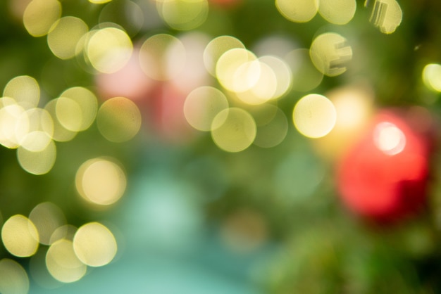 Selective focus Bokeh background of Christmas tree for celebrating festival with lighting