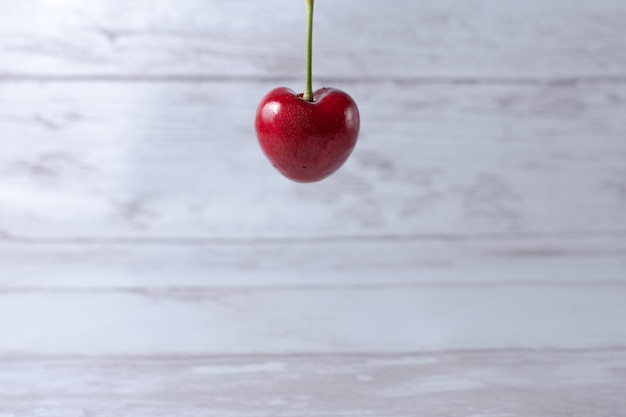 Selective focus of a cherry on a light background.