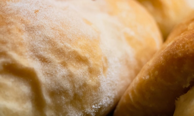 Selective focus closeup of freshly baked yeast puff dough strudel pastries and bakery products