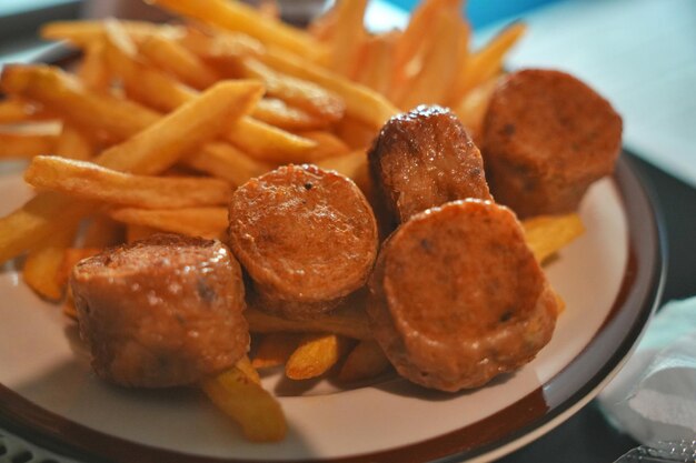 Selective focus on Deep Fried Crab Meat Rolls and French fries for eating