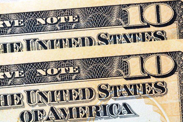 Photo selective focus on detail of usd banknotes close up macro detail of united states dollars banknotes world money concept inflation and economy concept