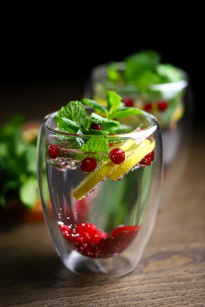 Selective focus. Detox water with mint, lemon and cranberry. Diet drinks. The keto diet.