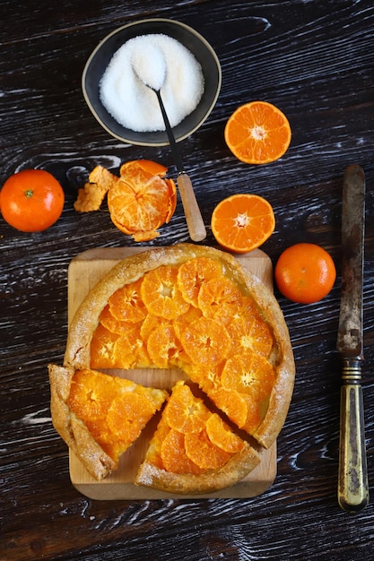 Selective focus Galette with tangerines Healthy dessert Citrus baking Tangerine tart