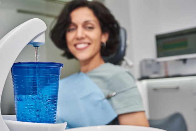 Selective focus of a glass with mouthwash.