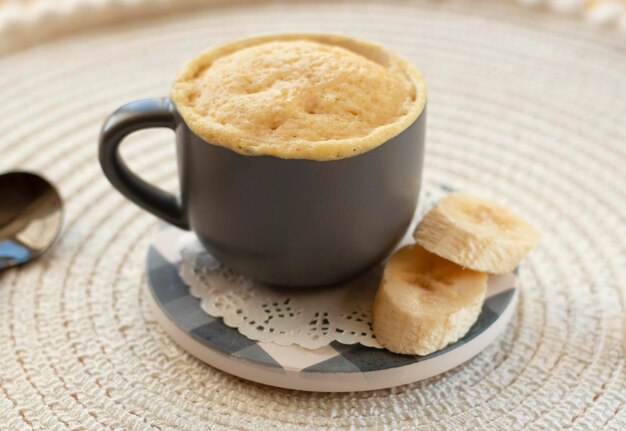 selective focus homemade portioned banana bread mugcake in small mugs