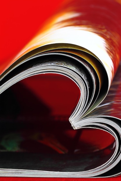 Photo selective focus image of magazine folded into a heart shape