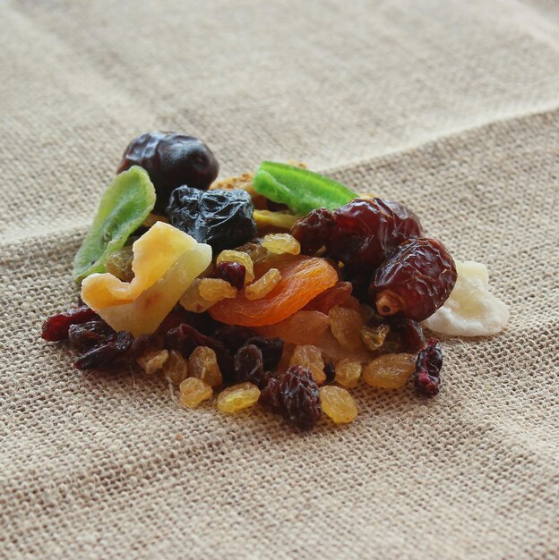 Selective focus image of mix dry fruits on jute burlap fabric