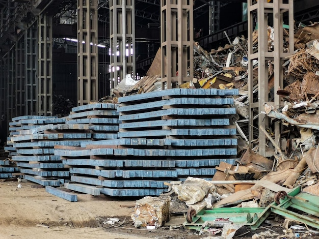 Photo selective focus image with noise effect steel billets in the steel plant warehouse.