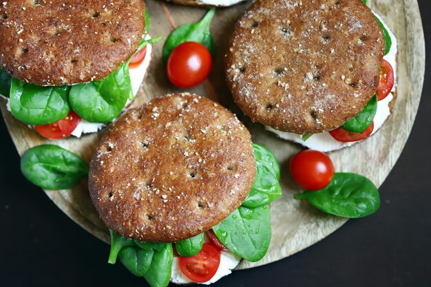 Selective focus Macro Healthy sandwiches with spinach tomatoes and Philadelphia cheese Delicious healthy food keto diet