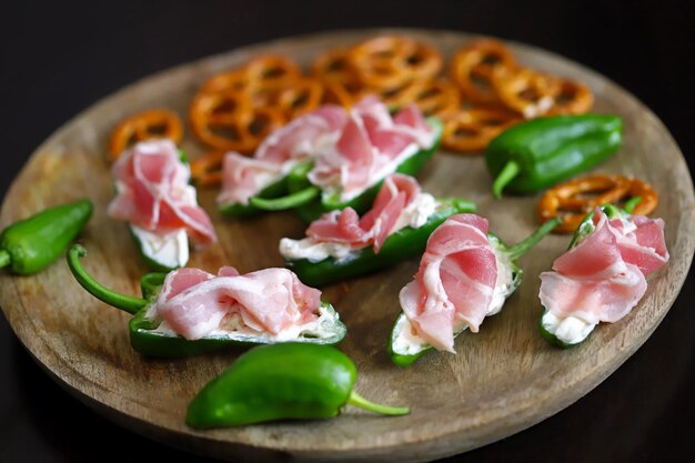 Selective focus Macro Small green jalapeno peppers stuffed with cream cheese and bacon