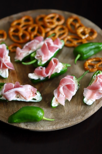 Selective focus Macro Small green jalapeno peppers stuffed with cream cheese and bacon