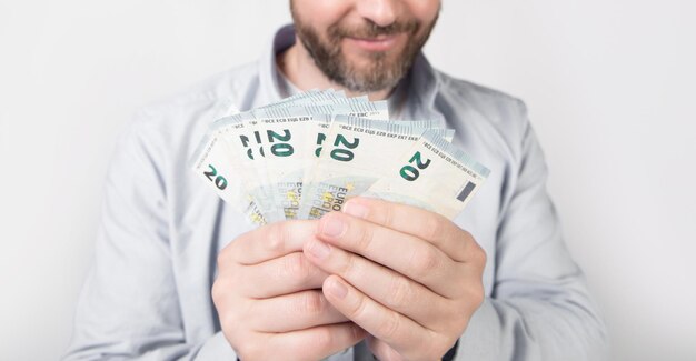 Selective focus of man with cash money in studio man with cash money banknotes