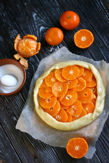 Selective focus Mandarin galette before baking Cooking citrus galette