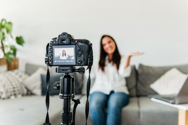 Selective focus photo of a happy female making a video