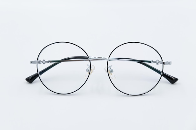 Selective focus round eyeglasses with silver rim Isolated white background