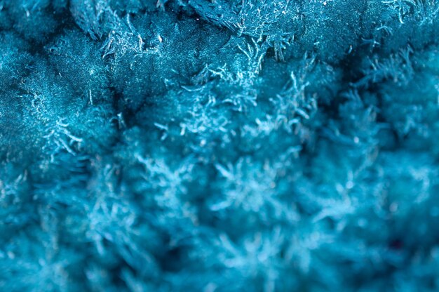 Selective focus shot of a blue frosty surface