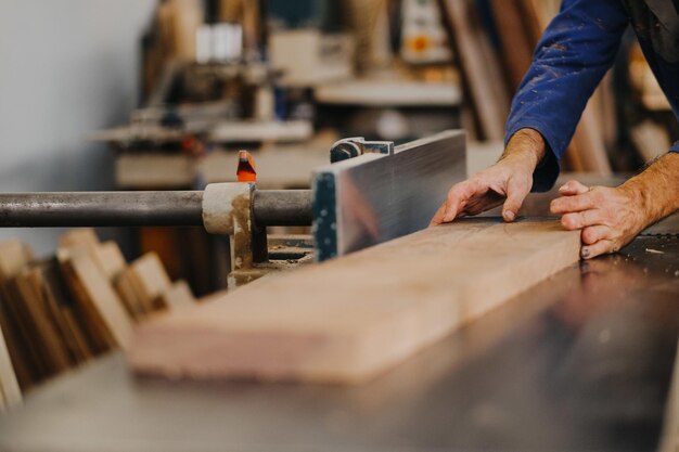 Selective focus shot of a craftsman working at workspace