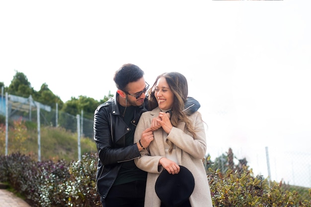 Selective focus shot of a cute couple looking at each other with love and smiling