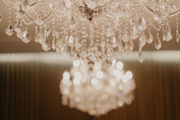 Selective focus shot of luxury chandeliers hanging on the ceiling