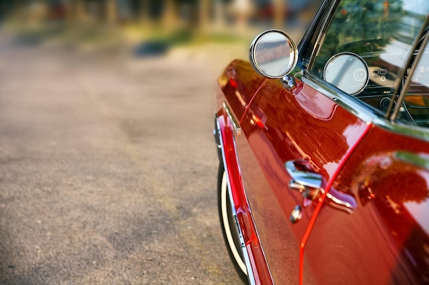 Selective focus shot of a red vintage car