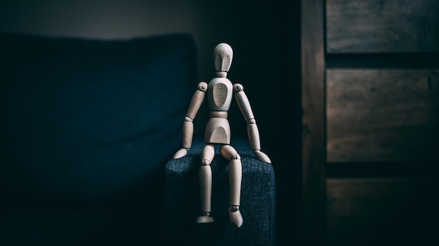 Selective focus shot of a wooden gestalt on a sofa