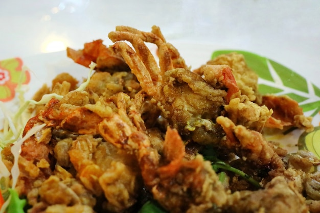 Selective focus of soft crab fried with garlic. Thai style seafood.