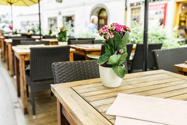 Selective focus of table of coffee shop outside view in Autria