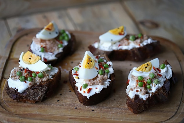 Selective focus. Toast with tuna and egg. Healthy toast. The keto diet.