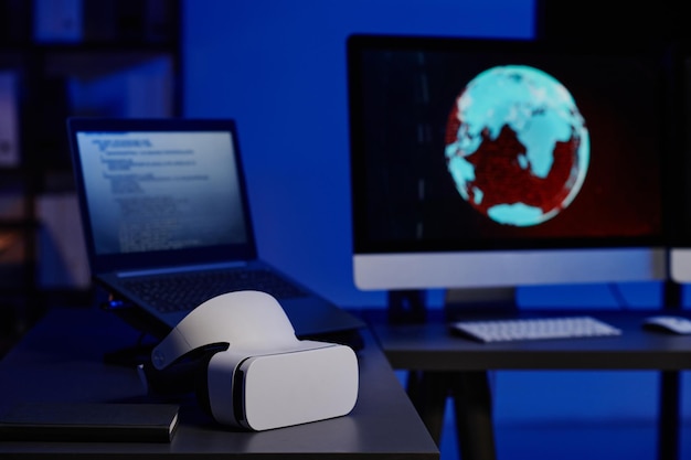 Selective focus on vr headset lying on workplace of programmer