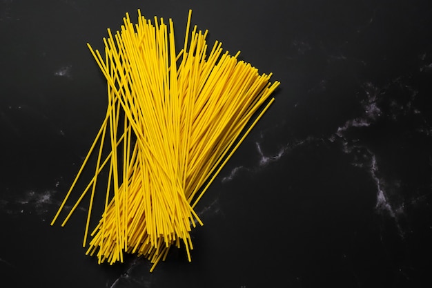 Selective focus yellow noodles in dish.food and copy space.raw pasta.Rice vermicelli and space.