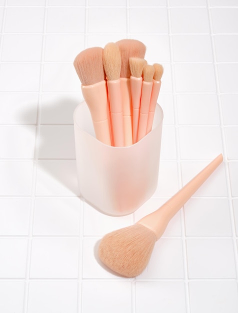 Self care beauty still life Lots of makeup brushes in a stand Beauty