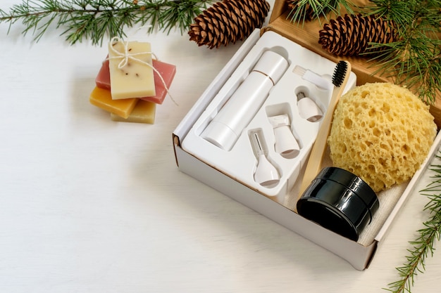 Self care seasonal gift box with zero waste cosmetics products and face massager.