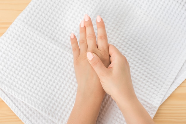 Self hand massage by caucasian young woman. Fingers and hand joint health. Self massage. Healthy Massage. Closeup hand of person massage her hand from pain in healthy concept