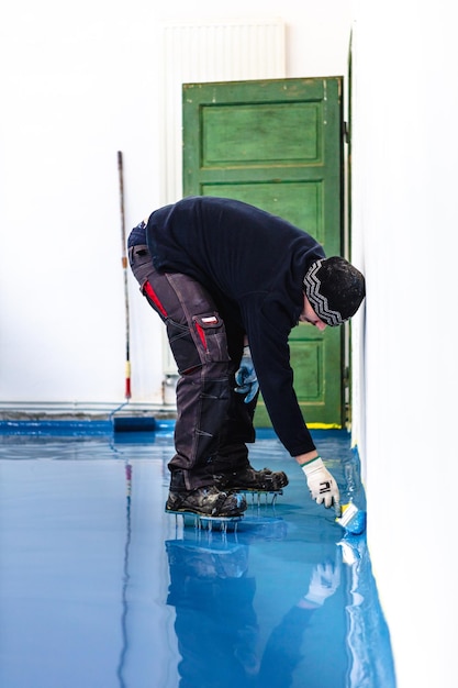 Self leveling blue epoxy floor in the gym