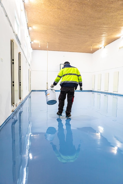 Self leveling blue epoxy floor in the gym