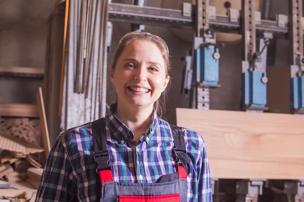 Selfconfident woman engineer at woodworking plant indoor