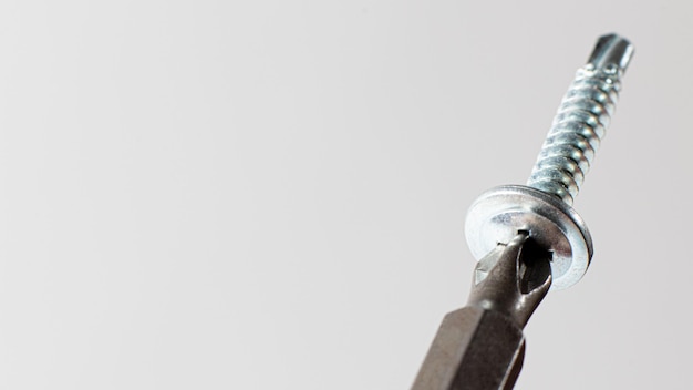 Selfcutters and screwdriver on a gray background