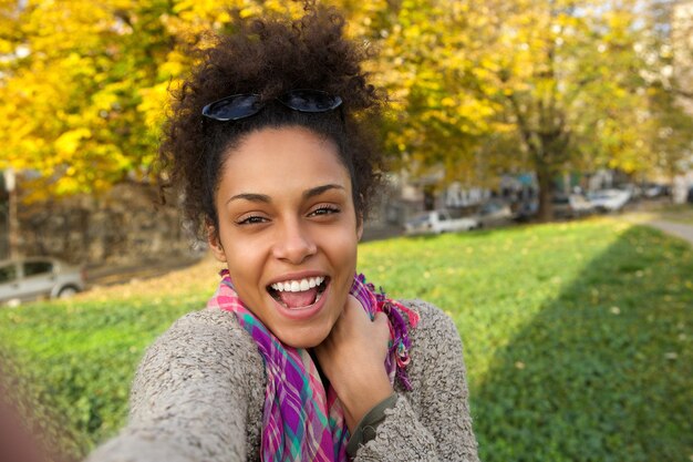 Photo selfie portrait of a happy young woman