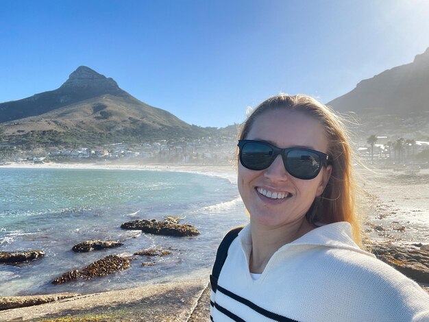 Selfie of a smiling woman at the ciiffton beach in cape town