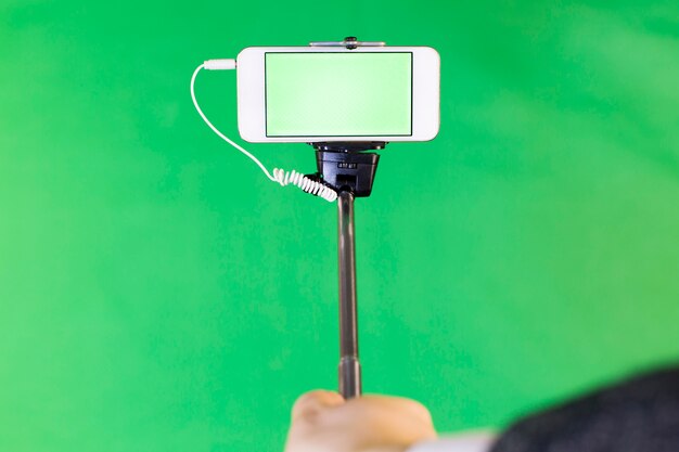 Photo selfie stick on green