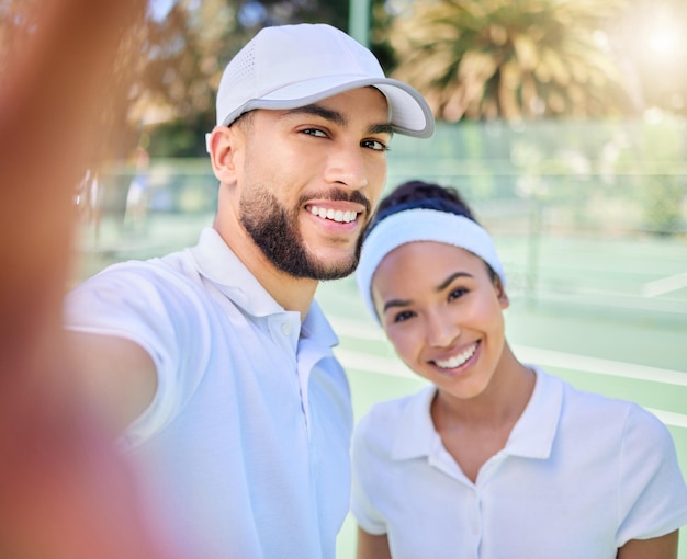 selfie tennis and sports with a couple on a court to take a photograph after their training or game portrait fitness and sport with a man and woman tennis player posing for a picture together