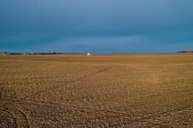 Photo selfisolation in a lonely house in the middle of a field top view from a drone