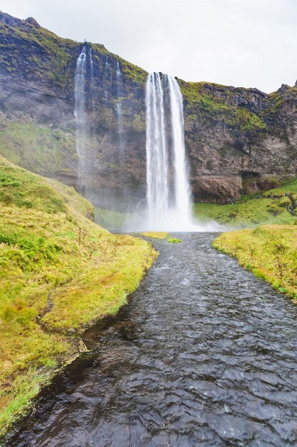 Seljalands river and seljalandsfoss waterfall