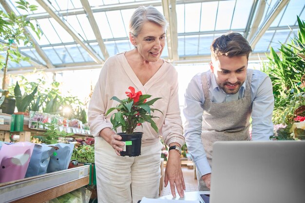 Seller is a florist making a purchase in his store