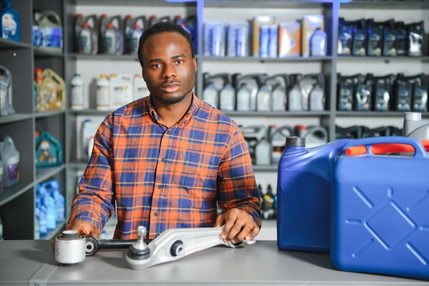 Photo seller man with canister of motor oil in auto store