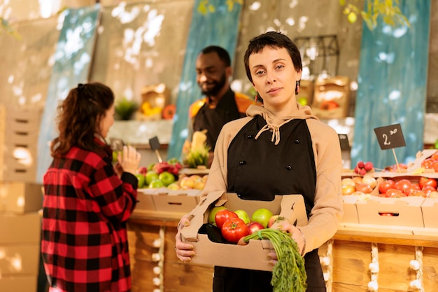 Seller shows box of organic eco produce