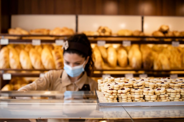 Selling cookies and pastry in bakery shop